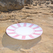 Pink and white target on a rocky surface
